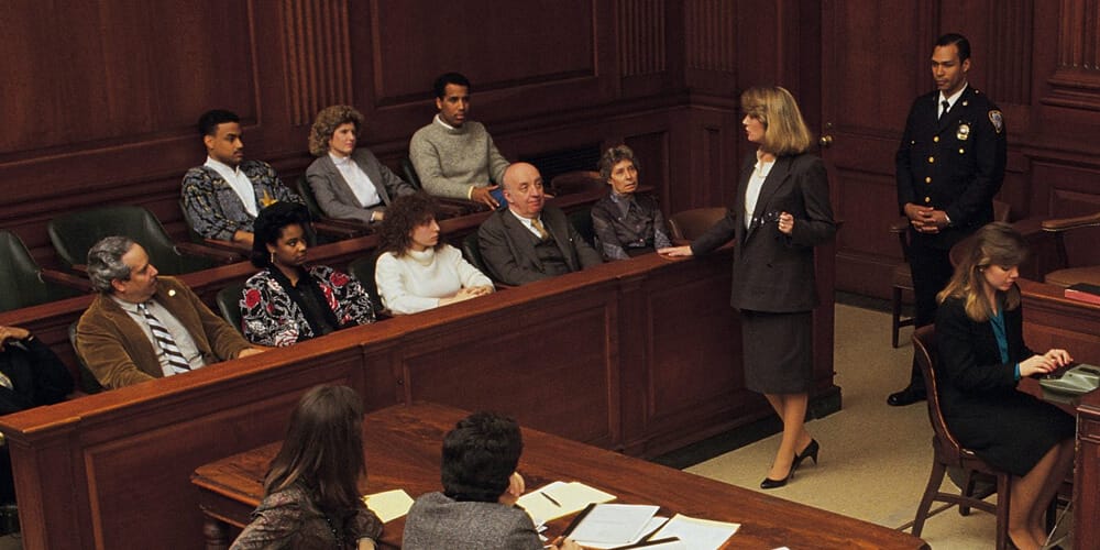Female attorney addresses the jury and reviews the facts of the deposition testimony presented at trial